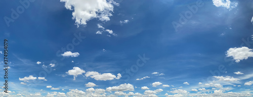 Panorama of a blue sky with white clouds, as background.  © Omar Molina