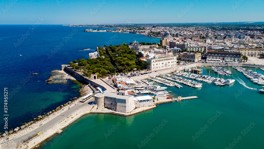Aerial view of Trani in the southeastern region of Apulia in Italy - Old marina with fishing boats on the Adriatic coast