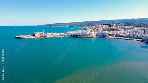 Aerial view of Vieste on the Gargano Peninsula in Italy - Medieval city with white buildings built on a narrow peninsula over the Adriatic Sea