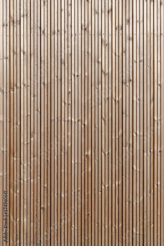Wood paneling background texture. Modern ecological wooden facade backdrop
