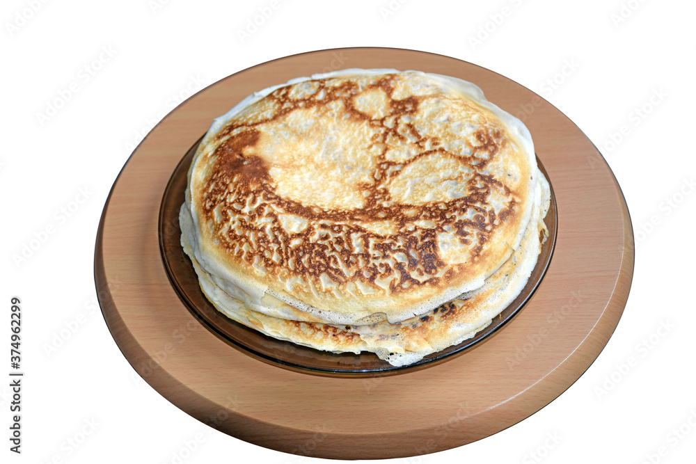 Big Stack of delicious pancakes on plate. Russian national cuisine. Homemade a pile of round golden pancakes on a wooden stand isolated on white background, close-up Big Stack of delicious pancakes on plate. Russian national cuisine. Homemade a pile of round golden pancakes on a wooden stand isolated on white background, close-up