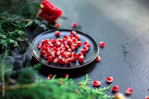 pomegranate sweet ripe red fruit on the table new year treat christmas serving portion size top view place copy space for text