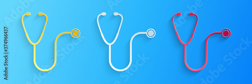 Paper cut Stethoscope medical instrument icon isolated on blue background. Paper art style. Vector.