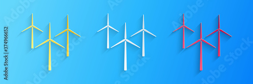 Paper cut Wind turbine icon isolated on blue background. Wind generator sign. Windmill silhouette. Windmills for electric power production. Paper art style. Vector.