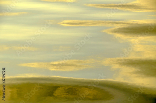 Texture and detail of a calm sea at sunrise to use as a background.