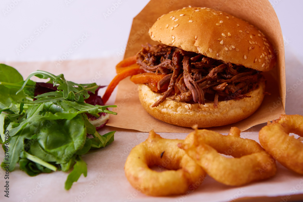 Sweet bun barbecue beef brisket with watercress leaves. Whisky barrel