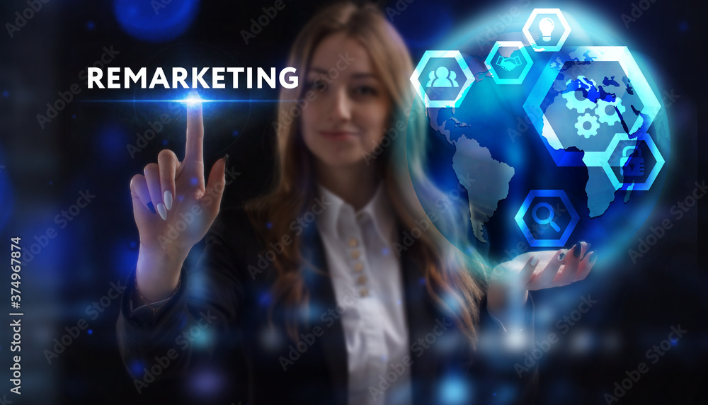 Business, Technology, Internet and network concept. Young businessman working on a virtual screen of the future and sees the inscription: Remarketing Business, Technology, Internet and network concept. Young businessman working on a virtual screen of the future and sees the inscription: Remarketing