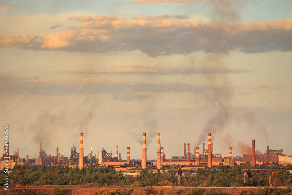 Fototapeta premium Panorama of a metallurgical plant that smokes