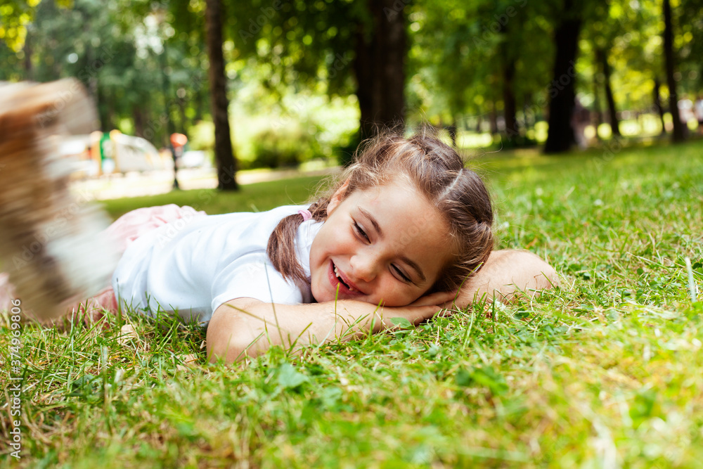 little cute caucasian girl playing cheerful in green park at summer, lifestyle people concept little cute caucasian girl playing cheerful in green park at summer, lifestyle people concept