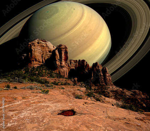 Conceptual view of Saturn Rising behind Cathedral Rock, Sedona, Arizona, USA photo