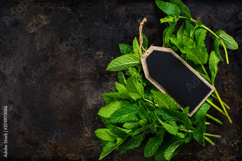 Fresh Mint Leaves with a blank chalkboard label photo