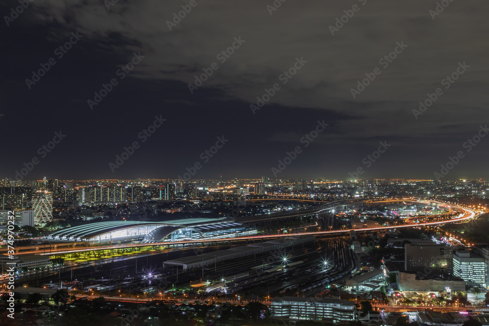 Bangkok, thailand - Aug 28, 2020 : Aerial view of Bang Sue central station with skyscrapers background at night. Selective focus.