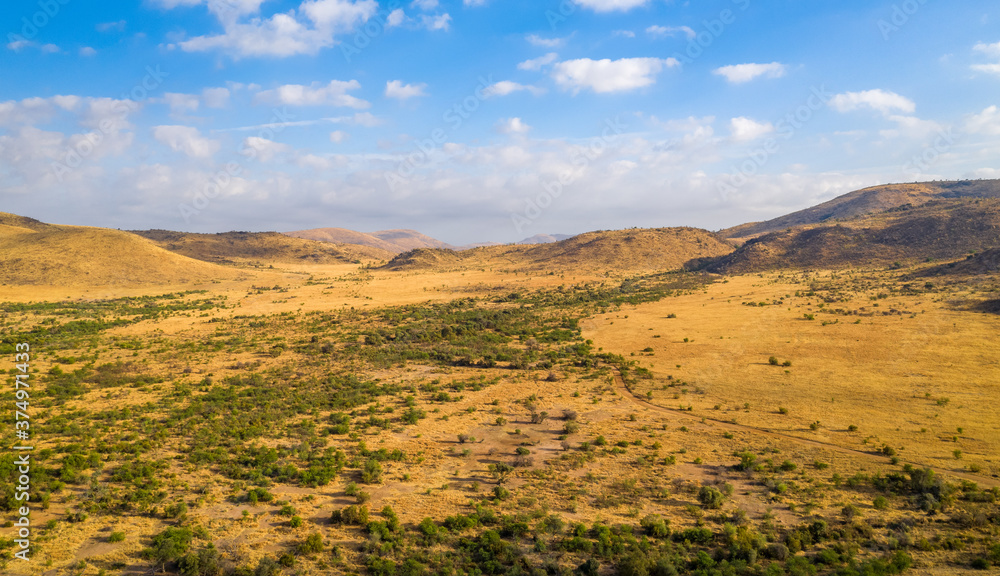 Panoramic aerial view of mountains on sunny day in Pilanesberg National Park, South Africa Panoramic aerial view of mountains on sunny day in Pilanesberg National Park, South Africa