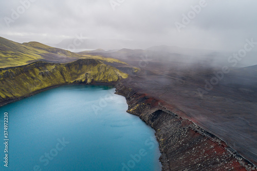 Aerial view of crater lake Blahylur, also known as Hnausapollur, with rainshowers, Fjallabak, highlands of Iceland photo