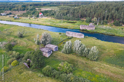 Obraz na płótnie Aerial view over historical german dam combined with a railroad embankment built in 1938 for defense purposes. Drezdenko / Poland. w salonie