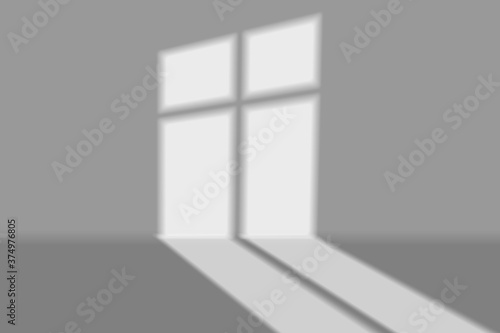 Window light shadow on grey wall