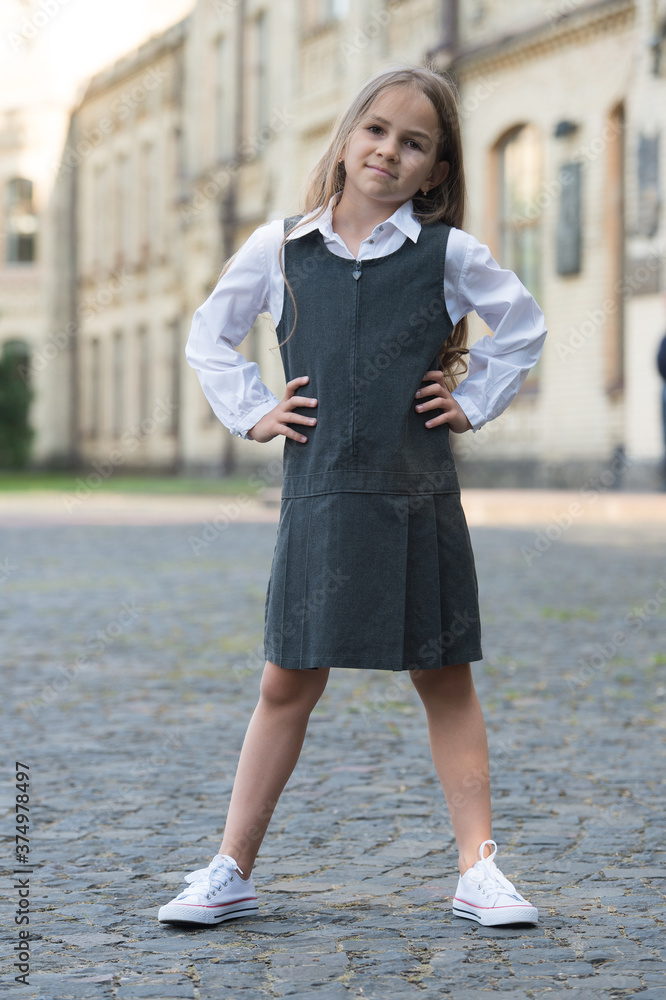 Become ready. Small kid wear uniform outdoors. Fashion look of little schoolchild. Back to school fashion. Schoolwear trends. Formal education. Knowledge day. September 1 Become ready. Small kid wear uniform outdoors. Fashion look of little schoolchild. Back to school fashion. Schoolwear trends. Formal education. Knowledge day. September 1