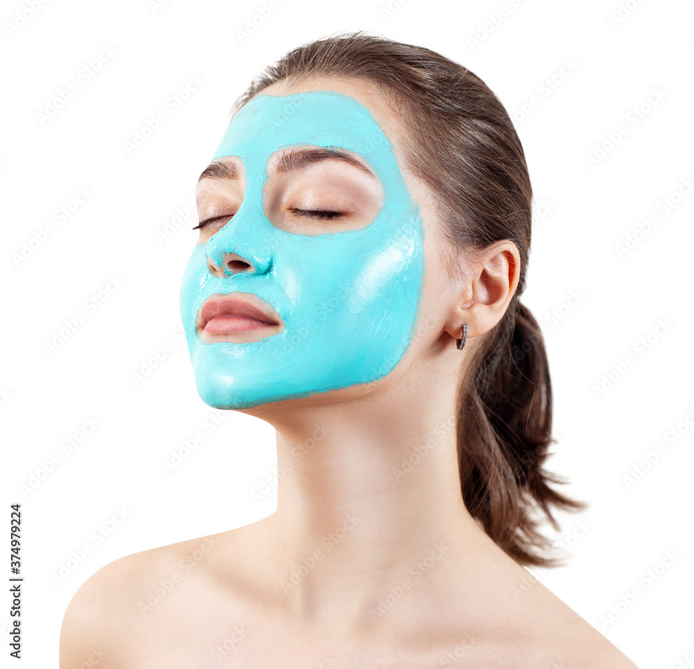 Blue vitamin facial clay mask on young woman face.