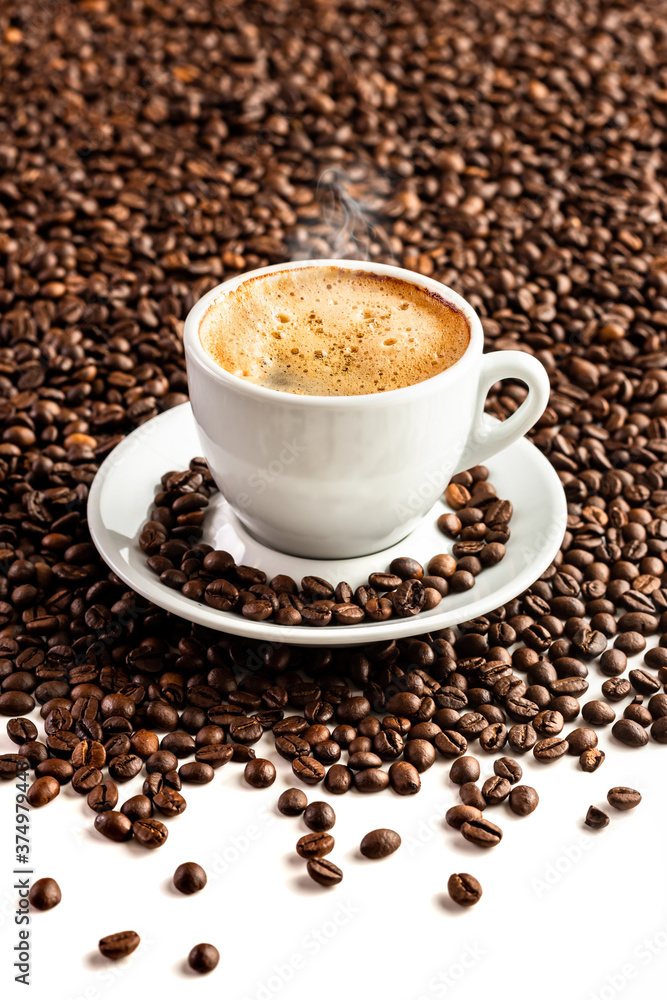 Cup with coffee on the background of coffee beans Cup with coffee on the background of coffee beans