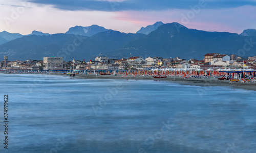 The view from the Viareggio pier at sunset is spectacular  the Apuan Alps appear in the background.