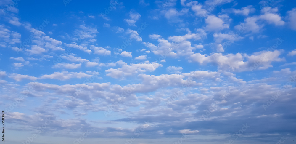 Blank sky surface with small clouds Blank sky surface with small clouds