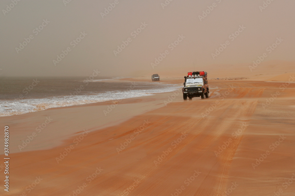Cars between the desert and the ocean Cars between the desert and the ocean