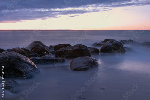 rocks with smooth sea at dawn