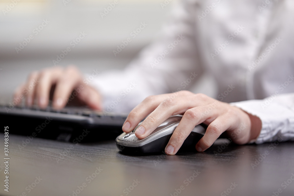 Female hands or woman office worker typing on the keyboard Female hands or woman office worker typing on the keyboard
