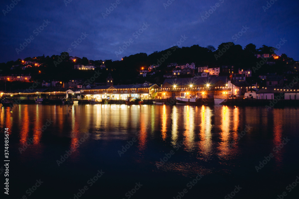 Fishing village with small harbour in Cornwall, UK Fishing village with small harbour in Cornwall, UK