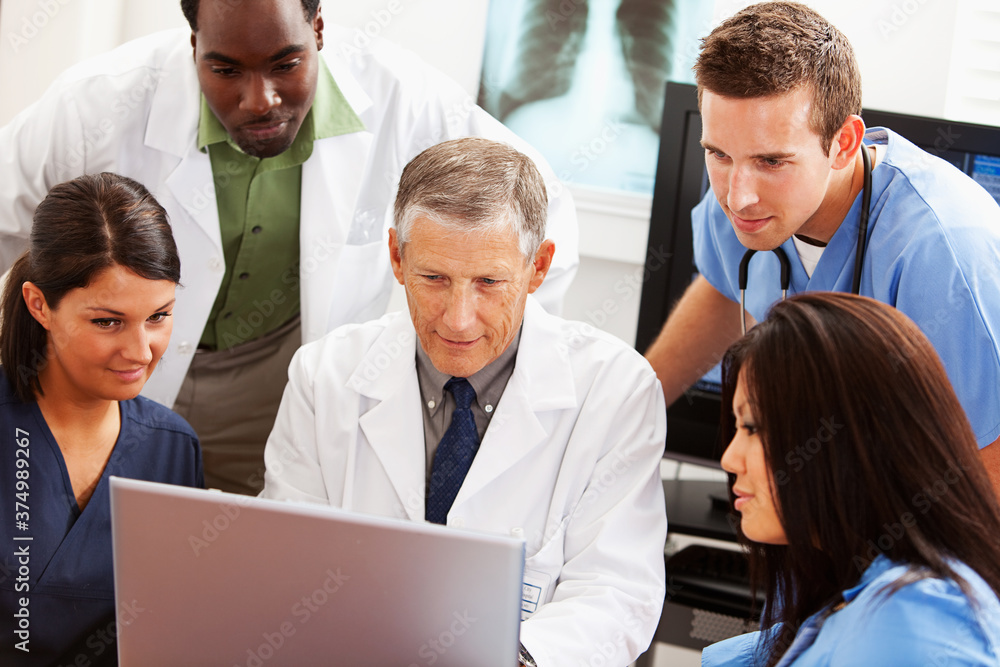 Doctors: Medical Team Reviews Data on Computer Doctors: Medical Team Reviews Data on Computer