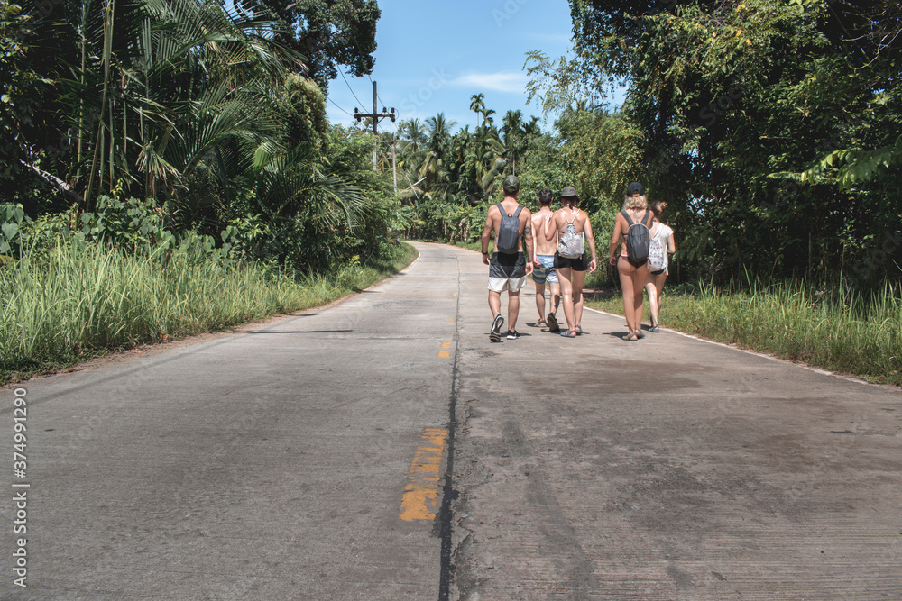 Five friends walk in the sun on the Thai streets. Five friends walk in the sun on the Thai streets.