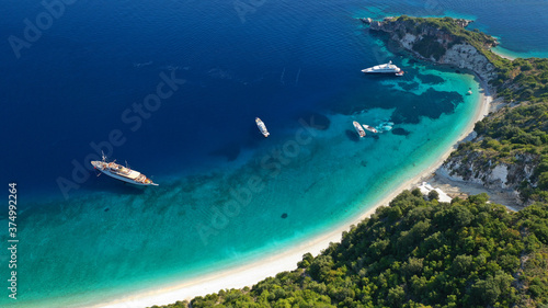 Aerial drone photo of beautiful paradise steep cliff sandy beach of Gidaki accessible by short hiking in beautiful Ionian island of Ithaki or Ithaca, Greece © aerial-drone