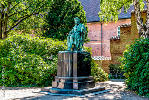 Bronze statue of Danish philosopher Soren Kierkegaard, in the Royal Library Garden on Slotsholmen in central Copenhagen, Denmark. photo