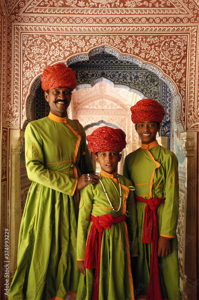 India, Jaipur, Samode Palace, father and sons in hallway, portrait