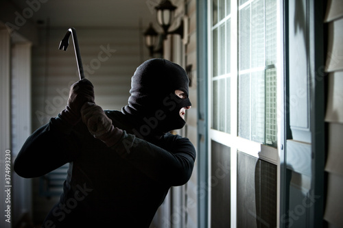 Burglar: Guy in Mask Ready to Break Window