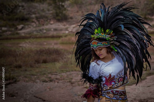 BEAUTIFUL MEXICAN WOMAN WEARING CEREMONIAL COSTUME MEXICA