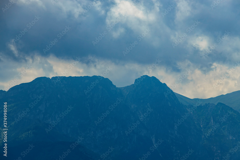 landscape of the Tatra Mountains and Giewont Gubałówka on a warm summer cloudy holiday day landscape of the Tatra Mountains and Giewont Gubałówka on a warm summer cloudy holiday day