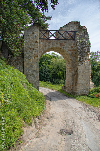 old stone historic gate in ruin with an old stone castle in Poland in Dobczyce