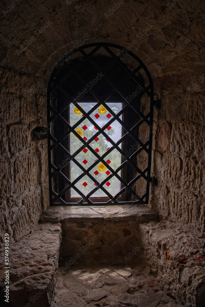  narrow antique window in the stone castle in the interior