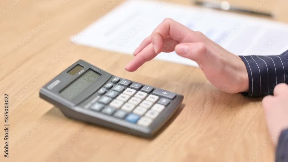 Close up of Hand using Calculator Close up of Hand using Calculator