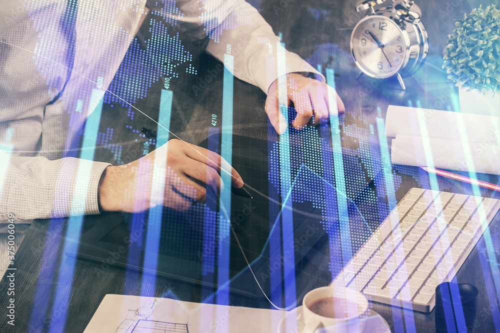 Double exposure of man's hands holding and using a phone and financial graph drawing. Analysis concept. Double exposure of man's hands holding and using a phone and financial graph drawing. Analysis concept.