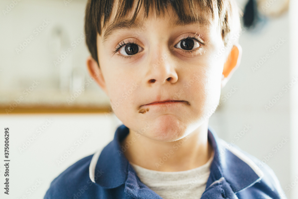 Portrait of kid with dirty mouth with chocolate Portrait of kid with dirty mouth with chocolate