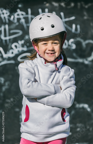 Little Girl Roller Skating in the Park photo