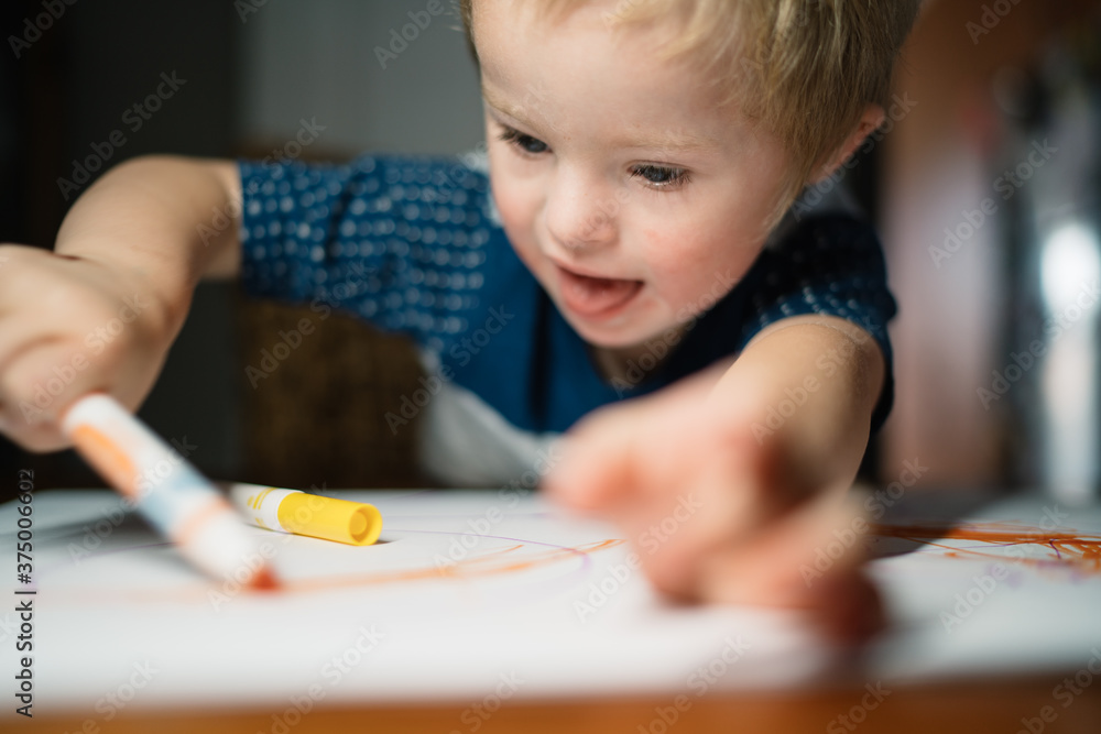 Little Boy Happily Drawing