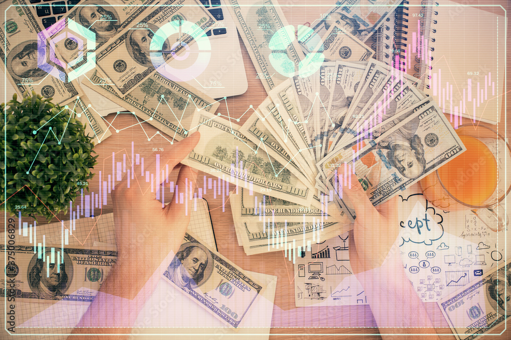 Multi exposure of financial graph drawing hologram and USA dollars bills and man hands. Analysis concept. Multi exposure of financial graph drawing hologram and USA dollars bills and man hands. Analysis concept.