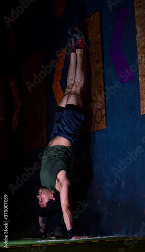 Mexican athlete practicing crossfit in a gym