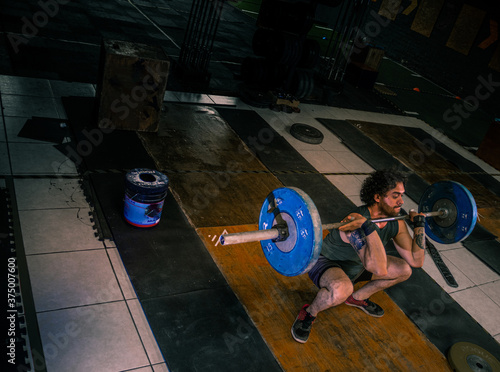 Mexican athlete practicing crossfit in a gym