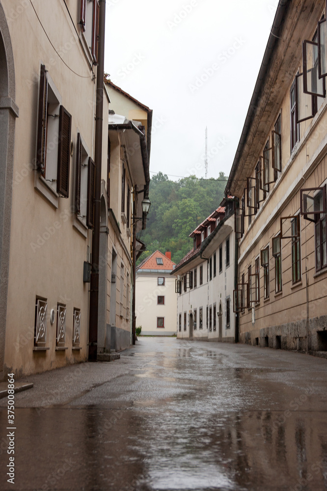 The old narrow street on a rainy day