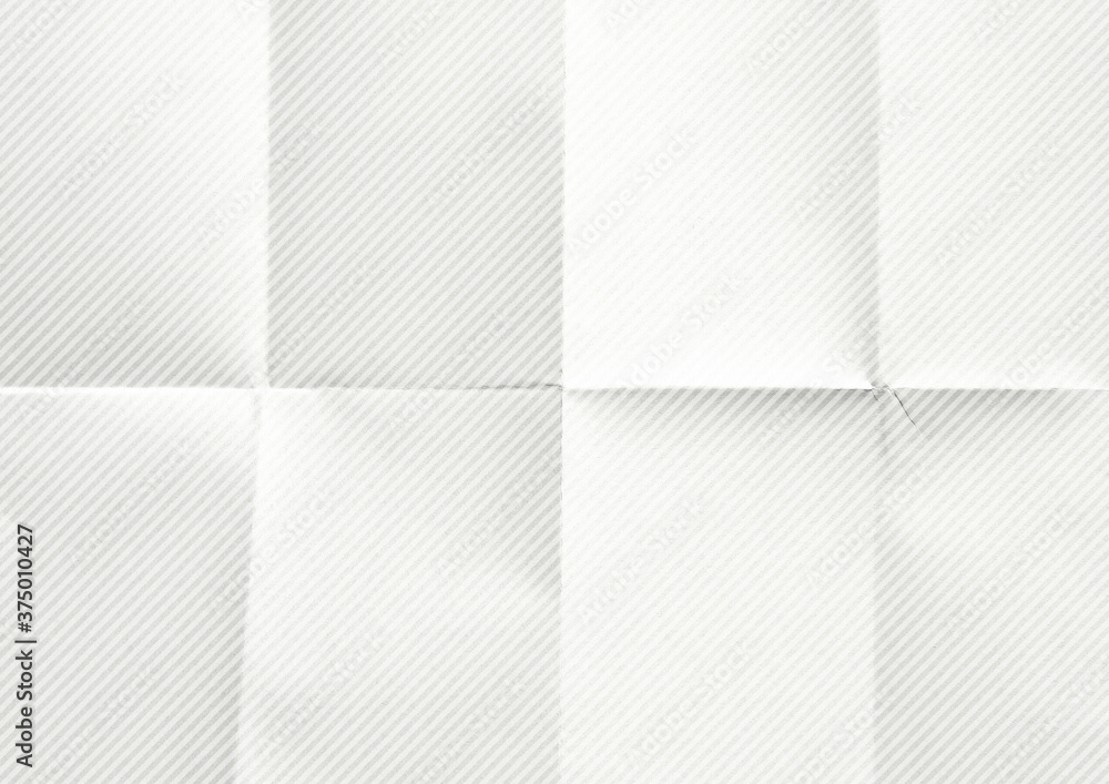 White crumpled diagonal striped paper background. White crumpled diagonal striped paper background.