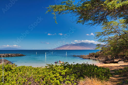 Kihei boat ramp on a bright sunny day with Ko olawe island in the distance.